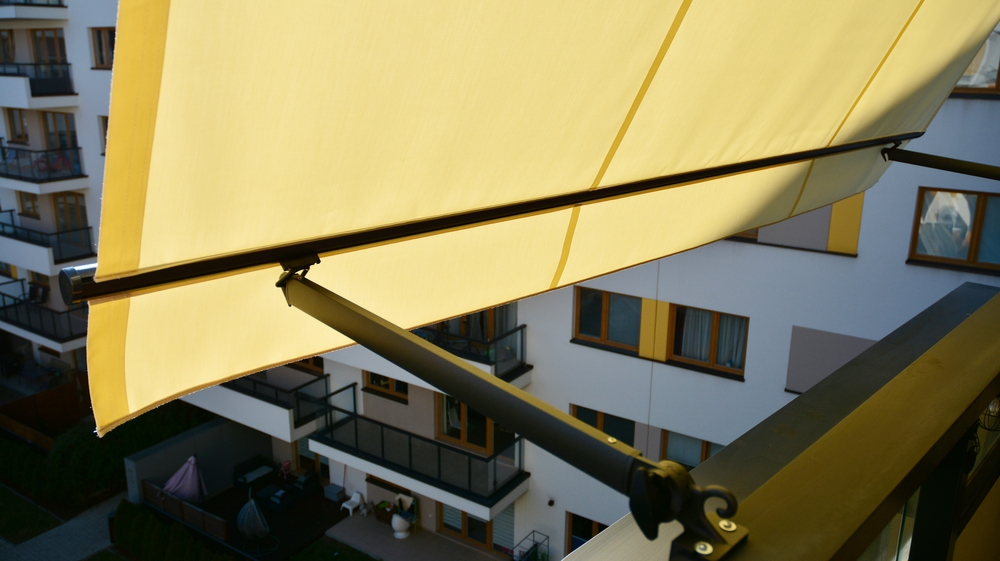 Creating a Vacation Vibe with Folding Arm Awnings