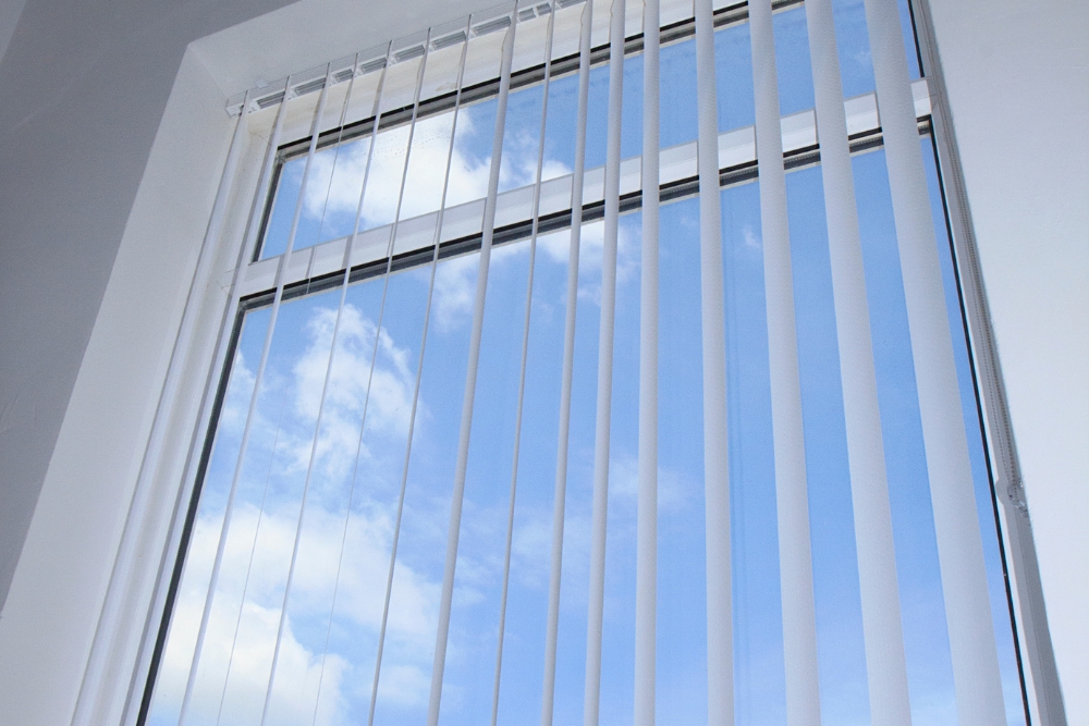 white outdoor blinds with the view of the skies