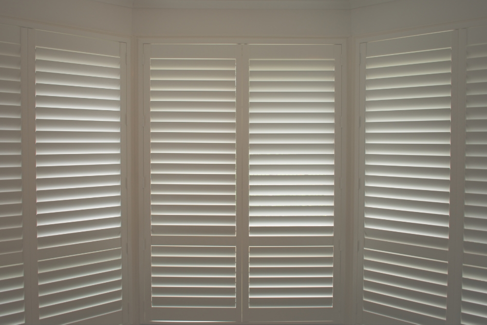 white shutters for window treatments